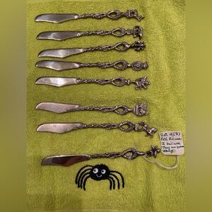 Set of 8 figural pate/cheese knives
 with Decorative Handles